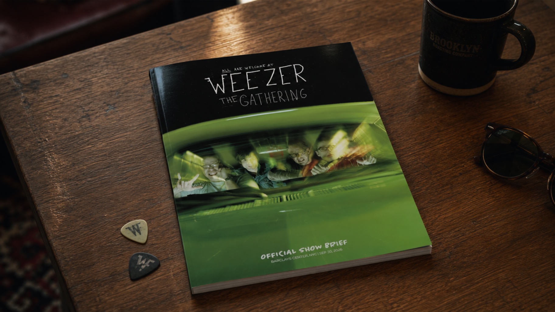 The Show Brief — a printed Weezer concert magazine on a coffee table